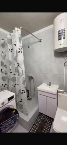 a bathroom with a shower and a toilet and a sink at Panoramic view in Tamga