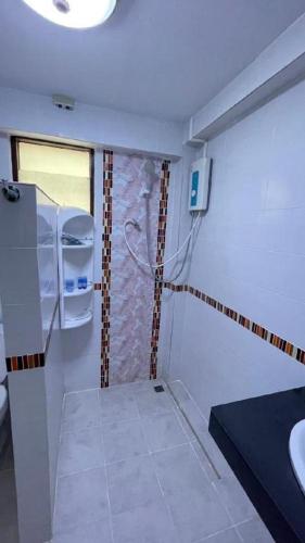 a bathroom with a toilet and a sink in a room at Jirawan Hotel in Ko Samed