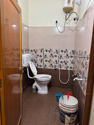 a bathroom with a toilet and a shower at Holidaypark Resort Araku in Araku