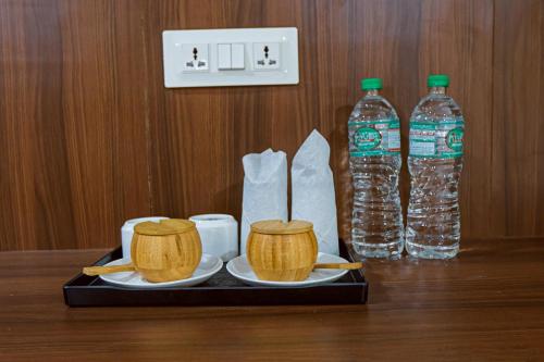 a tray with two bottles of water and two chop sticks at Batika Resort Sauraha in Sauraha
