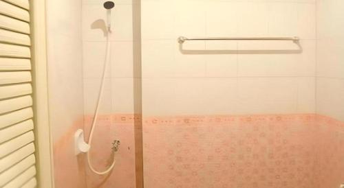 a shower with a glass door in a bathroom at Chanthanee Hotel in Ban Chamun (2)