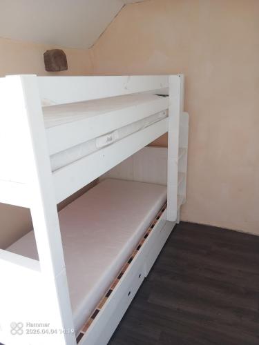 a white bunk bed in a room at house in Saint-André-des-Eaux