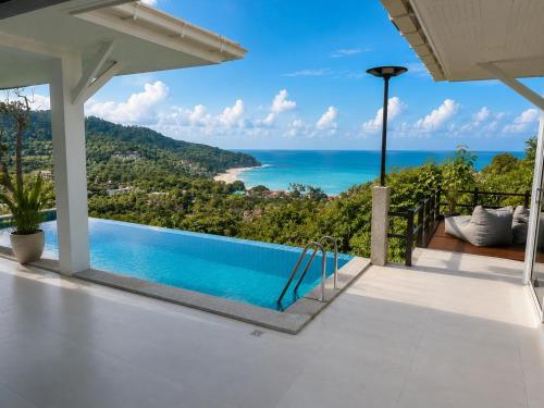 a villa with a view of the ocean at White Villa Lanta in Ko Lanta