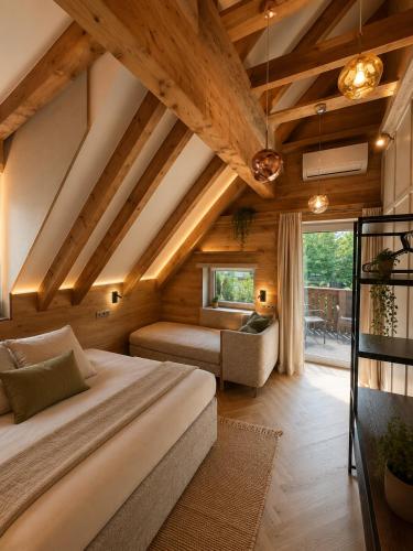 a bedroom with a large bed in a room with wooden ceilings at Book-A-Room Salzburg Garden or Balcony Stay - 2 bedroom - air conditioning & free parking in Salzburg