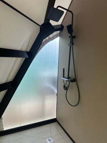 a camera in a room with a window at Ugam Glamping in Khumson