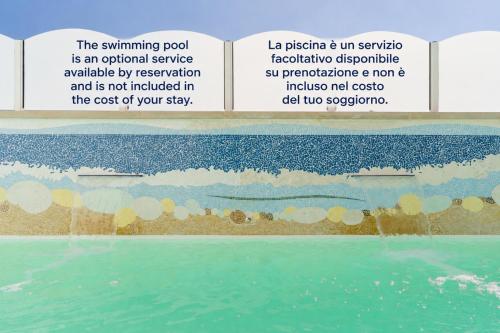 a page of a book with a picture of the ocean at Palazzo De Castro in Squinzano