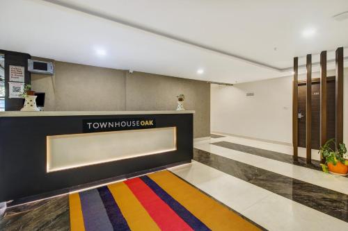 a lobby with a tumulus gym sign on the wall at Hotel O D Suites in Hyderabad