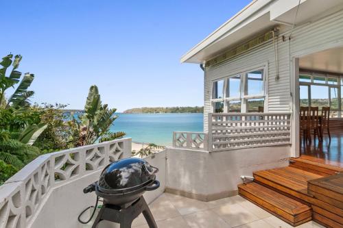 a barbecue on the balcony of a house at The Oriana in Sydney