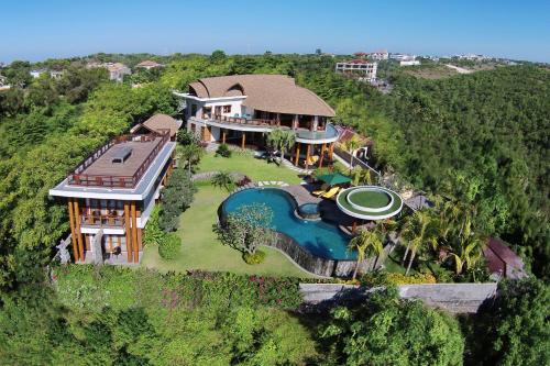 an aerial view of a house with a swimming pool at Casa Bonita Villa Bali in Jimbaran