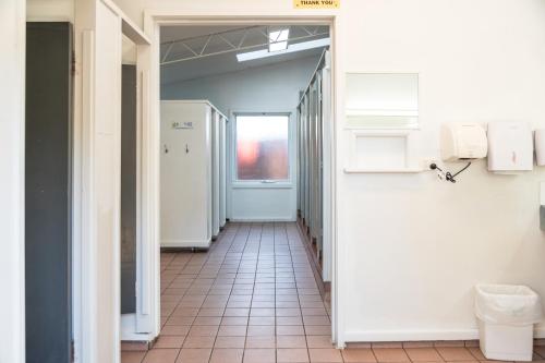 an empty hallway with a hallway leading to a bathroom at Geelong Holiday Park in Geelong