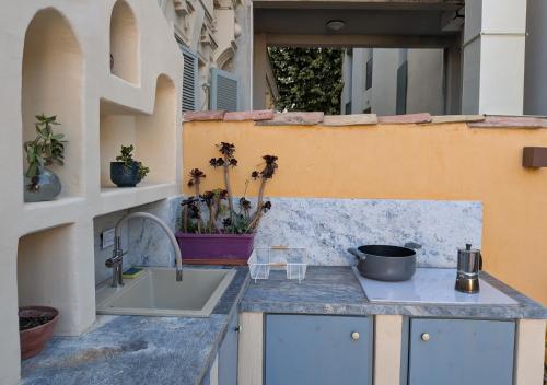 a kitchen with a sink and a counter top at Dieu Bé Nice in Nice
