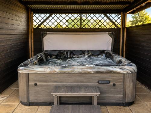 a bed in a gazebo with a table at Arch House in Florencecourt