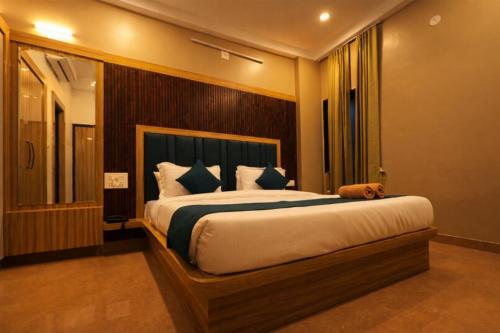a bedroom with a large bed in a room at Hotel venus inn sajjangarh in Udaipur