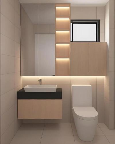 a bathroom with a toilet and a sink and a mirror at Sentral Suites By Eassy Hotel in Kuala Lumpur