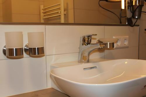 a bathroom with a sink and a mirror at Ferienwohnung Schwarzwaldnest in Feldberg
