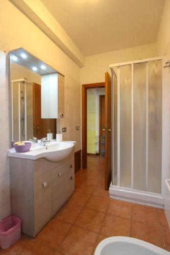 a bathroom with a sink and a shower at Podere Cerretini in Montepulciano