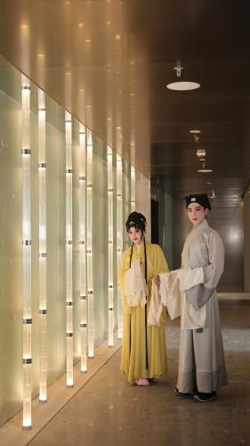 two people dressed in costumes standing in a hallway at Suzhou Marriott Hotel Yangcheng Lake in Suzhou