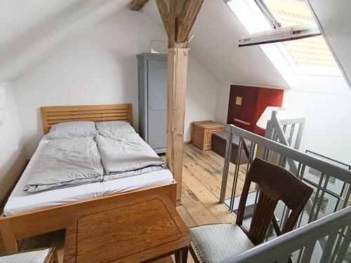 a bedroom with a bed on a balcony at Saulgrub Alpen Loft in Saulgrub