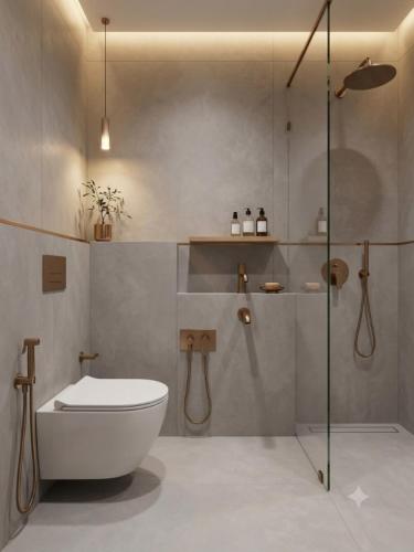 a bathroom with a toilet and a glass shower at Hotel De - Grand Villa Near Delhi IGI Airport in New Delhi