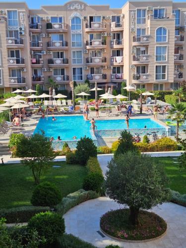 an apartment complex with a swimming pool and a resort at Apartments Vilma&Villiam in Ravda