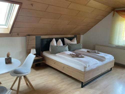 a bedroom with a large bed in a attic at Ferienhaus Barth in Bad Salzungen