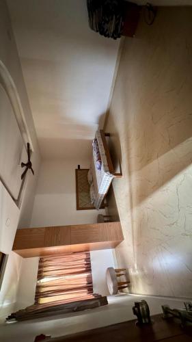 an attic room with a bed in a room at Siddhi farm in Kolhapur