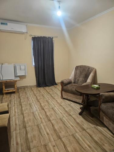 a living room with a couch and a table at NectaraVilla PooL in Ashtarak