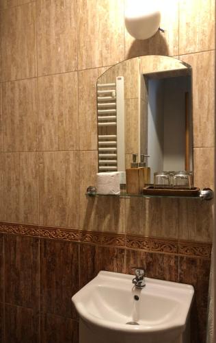 a bathroom with a sink and a mirror at Villa Old Mariner in Kotor