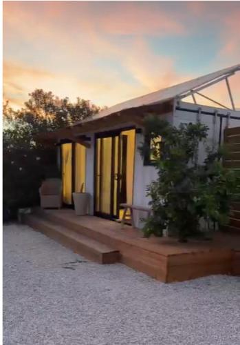 a small house with a porch with some plants at CasaNoa Boutique Guest Suites in Jávea