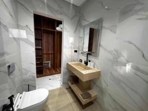 a bathroom with a sink and a toilet at Villa Zahra in Bizerte