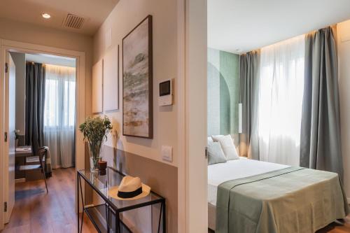 a hotel room with a bed and a window at The Circle Bike Residence by Rent All Como in Tavernerio