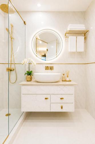 a bathroom with a sink and a mirror at Hotel Ve Atlantiis Elite in New Delhi