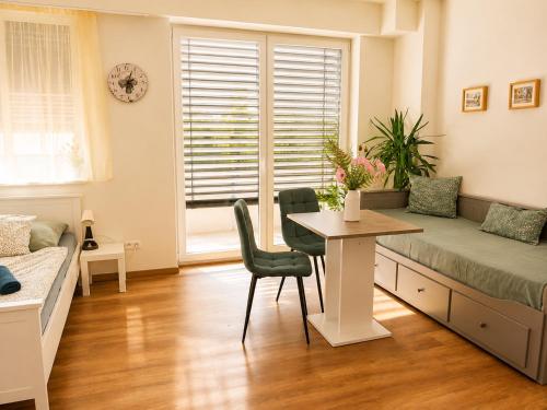 a living room with a couch and a table at TRIO apartment in Piešťany