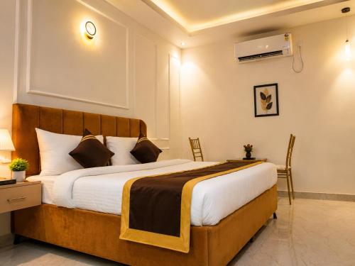 a bedroom with a large bed in a room at Ravira Resort in Sītāpur