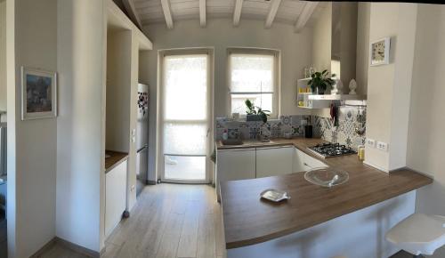 a kitchen with a wooden counter top in a room at Camere LaVigna in Carrara