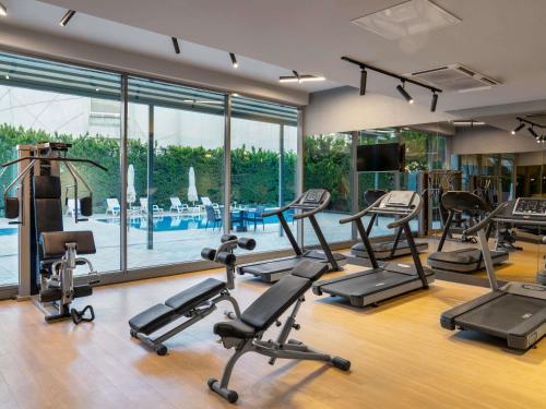 a gym with a bunch of treadmills and ellipticals at Novotel Gaziantep in Gaziantep