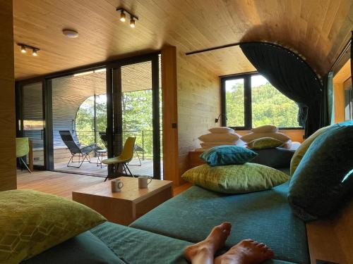 a room with four pillows on a couch at Wellness Chalet unterm Trifels in Annweiler am Trifels