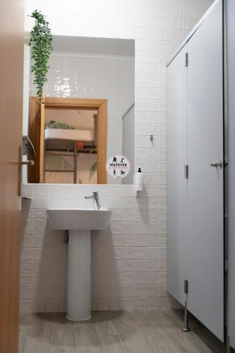 a bathroom with a sink and a mirror at WOT Patio Social in Lisbon