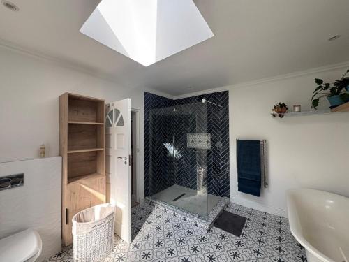 a bathroom with a shower and a sink and a toilet at Upper Constantia Entertainers dream! in Cape Town