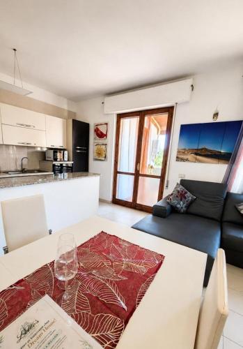 a living room with a table and a couch at Lello's Dream House in Càbras