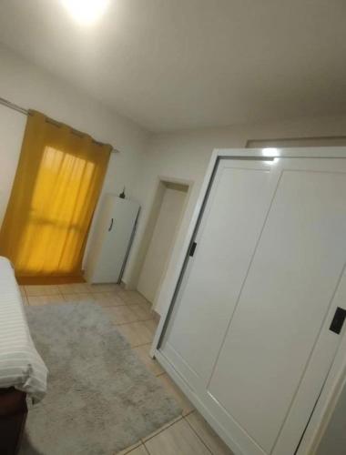 a room with a sliding door in a room at La pace in Libreville