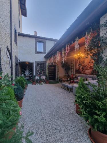 a courtyard of a building with benches and plants at b&b MADDIALE 