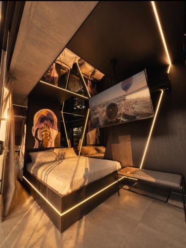a bedroom with a bed with lights on it at Forte das Araucarias in Urubici