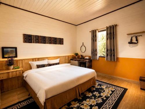 a bedroom with a large bed and a window at Mộc An SaPa Home in Sapa