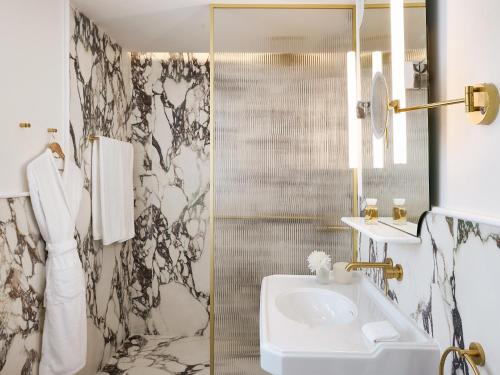a bathroom with a sink and a shower at ATHENA Pallas in Athens