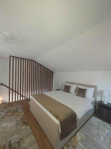 a bedroom with a large bed in a room at The Cozy Backyard Home- satu Mare in Satu Mare