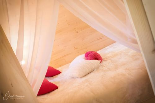 a stuffed animal laying on the floor in a room at La Cabane Spa De Céline in Voussac