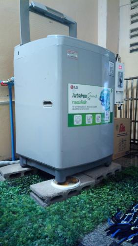 a machine sitting on the grass in a room at Hua Hin Euro City Hotel in Hua Hin