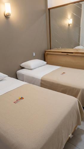 Postel nebo postele na pokoji v ubytování Hotel Riviera