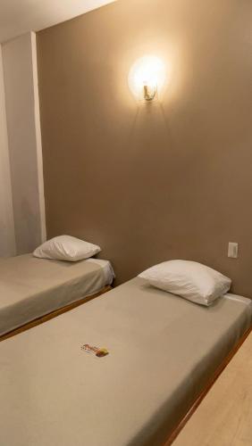 Postel nebo postele na pokoji v ubytování Hotel Riviera